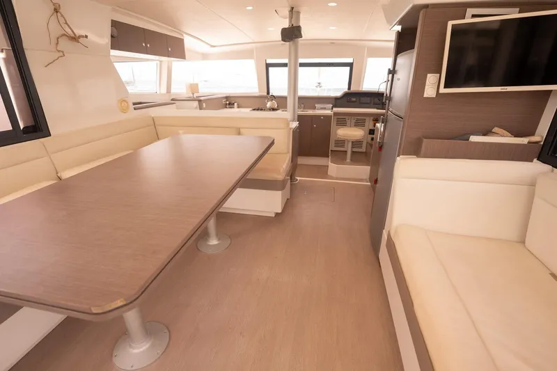Slide: The Image of Modern interior of a 2020 Bali 4.1 catamaran with spacious seating and dining area. - 13