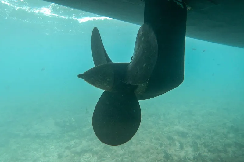 Slide: The Image of Underwater view of a Bali 4.1 yacht propeller, 2020 model, in clear blue water. - 45