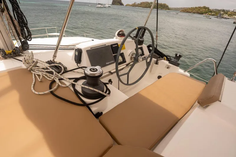 Slide: The Image of Helm of 2020 Bali 4.1 catamaran with steering wheel and navigation equipment. - 28