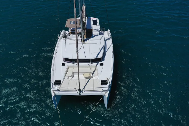 Slide: The Image of Aerial view of a 2020 Bali 4.1 catamaran sailing on clear blue water. - 7