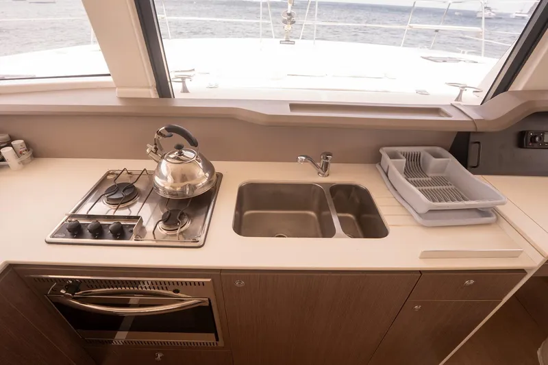 Slide: The Image of Modern yacht kitchen with stove, sink, and dish rack on a Bali 4.1, 2020 model. - 16