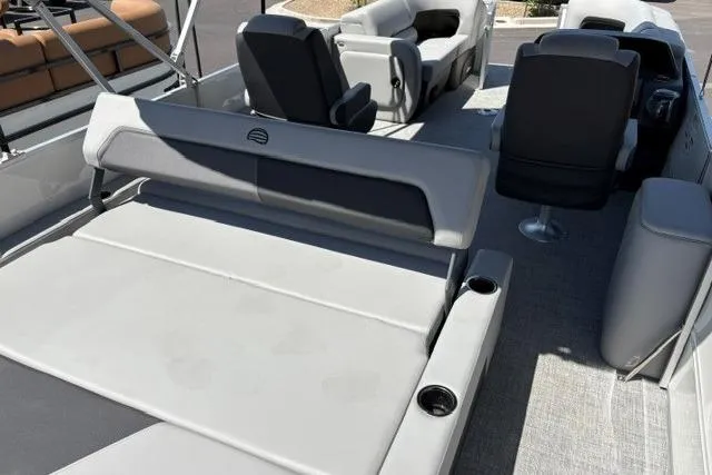 Slide: The Image of 2026 Sun Tracker Party Barge 22 RF DLX interior with comfortable seating and cup holders. - 3