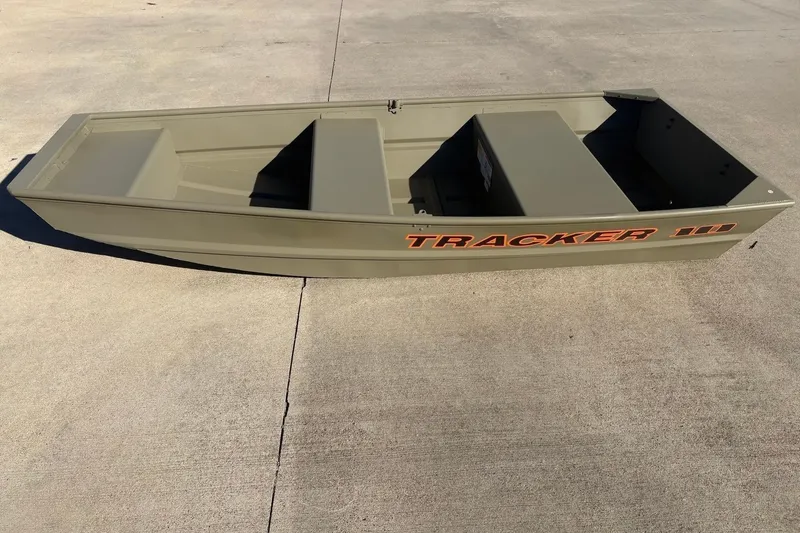 The Image of 2026 Tracker Grizzly 10 Jon boat on concrete surface, showcasing its sturdy design. - 0