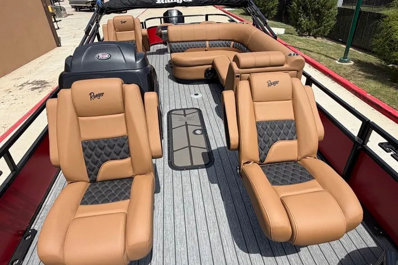 Slide: The Image of Luxurious 2026 Ranger 223F boat interior with tan leather seating and modern design. - 8