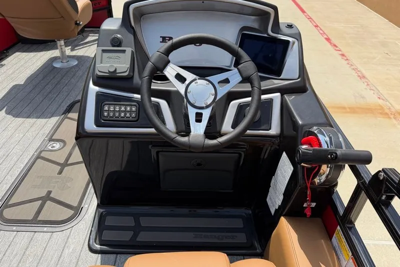 Slide: The Image of 2026 Ranger 223F boat dashboard with steering wheel and control panel. - 5