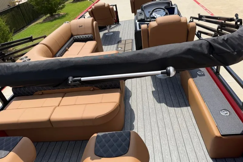 Slide: The Image of 2026 Ranger 223F boat interior with tan seating and modern design. - 9