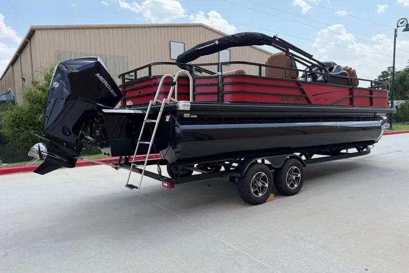 Slide: The Image of 2026 Ranger 223F pontoon boat with Mercury engine on trailer, parked outdoors. - 3