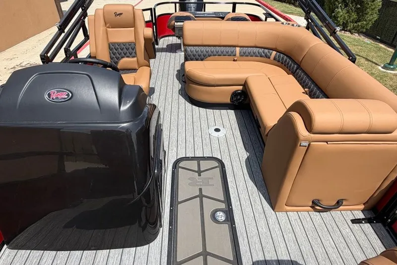 Slide: The Image of Luxurious interior of 2026 Ranger 223F boat with tan seating and sleek design. - 7