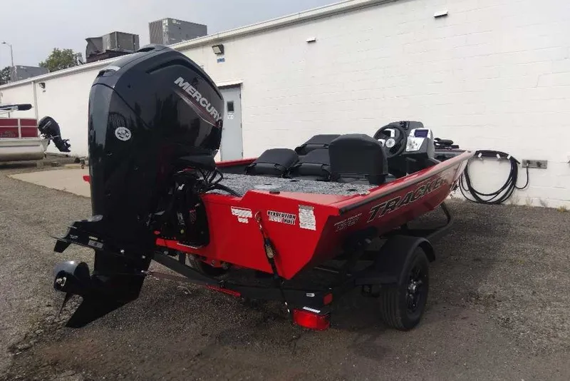 Slide: The Image of 2026 Tracker Pro Team 175 Crappie Edition boat with Mercury engine, parked outdoors. - 8
