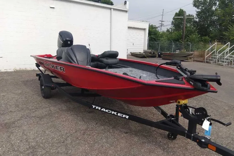 Slide: The Image of 2026 Tracker Pro Team 175 Crappie Edition boat in red, parked on a trailer. - 5