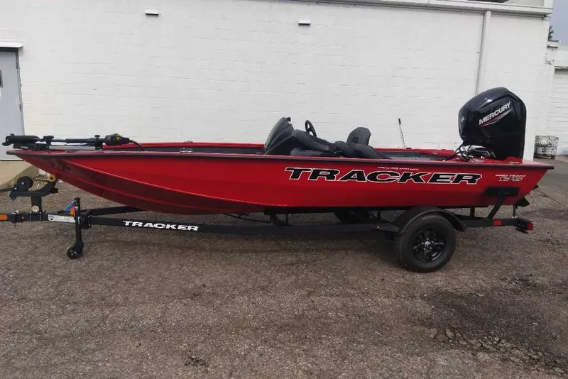 Slide: The Image of 2026 Tracker Pro Team 175 Crappie Edition boat in vibrant red on trailer. - 4