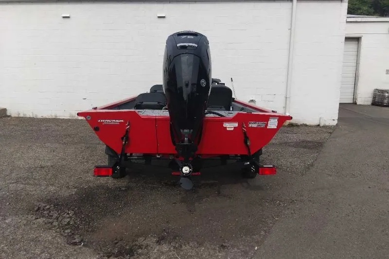 Slide: The Image of 2026 Tracker Pro Team 175 Crappie Edition boat, red exterior, parked outdoors. - 7