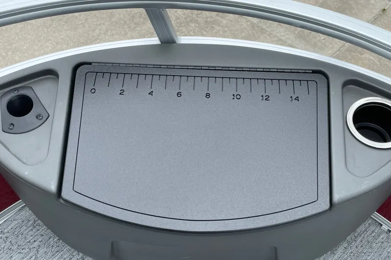 Slide: The Image of Control panel of 2026 Sun Tracker Bass Buggy 18 DLX with measurement markings. - 16