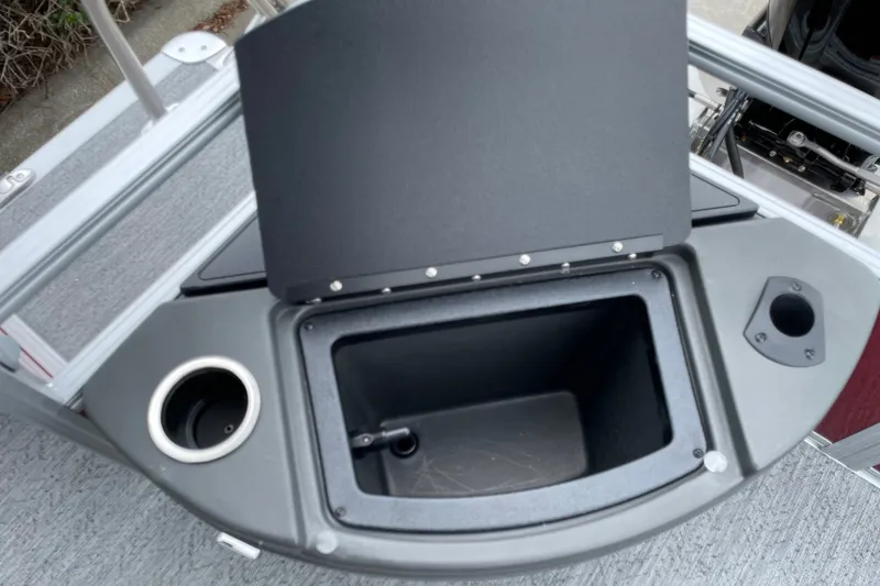 Slide: The Image of Open storage compartment on 2026 Sun Tracker Bass Buggy 18 DLX boat. - 19