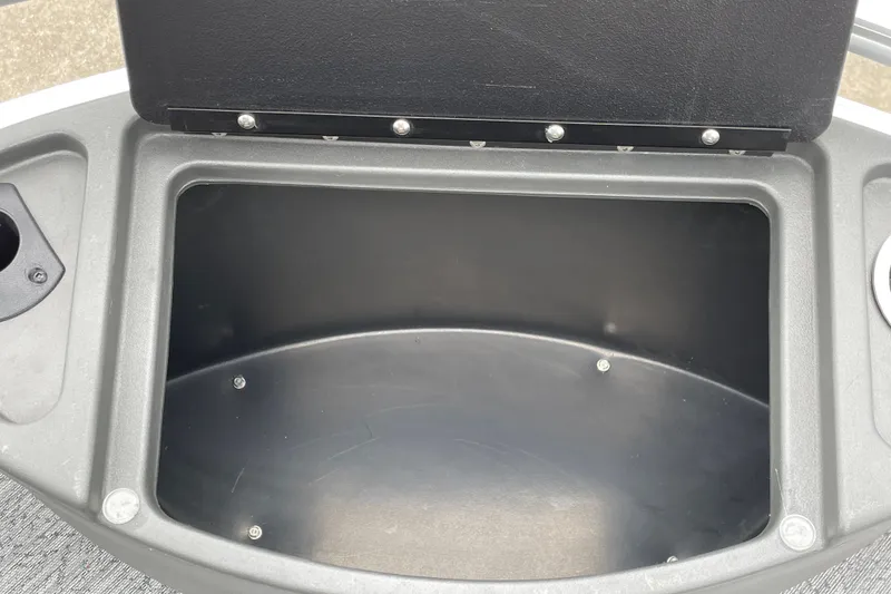 Slide: The Image of Storage compartment of 2026 Sun Tracker Bass Buggy 18 DLX boat, open lid view. - 17