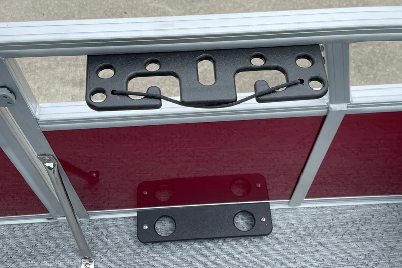 Slide: The Image of 2026 Sun Tracker Bass Buggy 18 DLX boat accessory mount on red panel. - 20