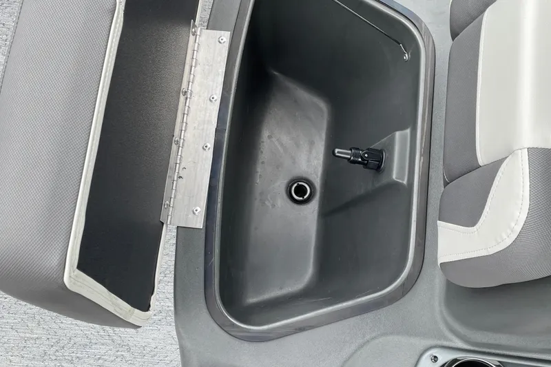 Slide: The Image of 2026 Sun Tracker Bass Buggy 18 DLX livewell and seating detail. - 23