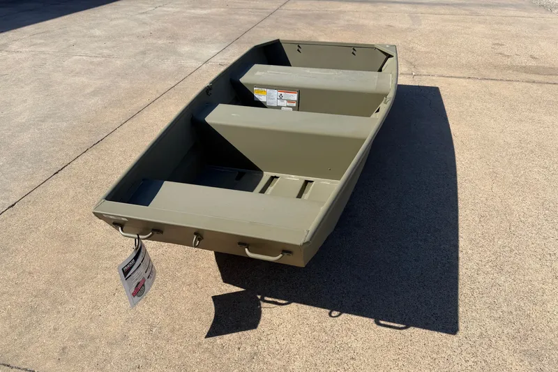 The Image of 2026 Tracker Grizzly 10 Jon boat on concrete surface, showcasing its compact design. - 0