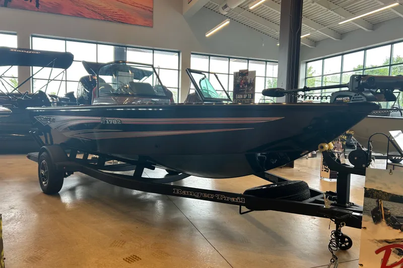 Slide: The Image of 2026 Ranger VS1782SC Angler boat displayed indoors on a trailer. - 9