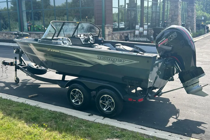 Slide: The Image of 2026 Ranger VX1788 WT boat on trailer with Mercury Pro XS engine, parked outdoors. - 11