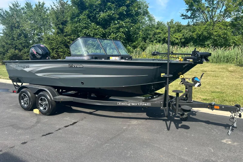 The Image of 2026 Ranger VX1788 WT fishing boat on trailer, parked outdoors. - 0