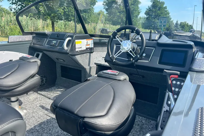 Slide: The Image of Interior of 2026 Ranger VX1788 WT boat with modern steering and seating. - 5
