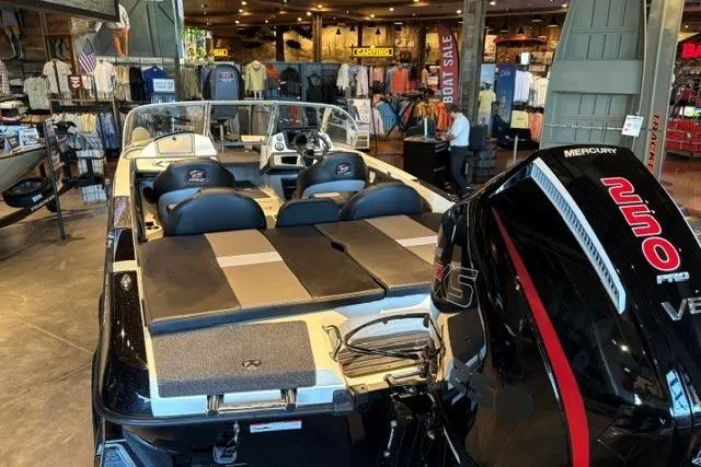 Slide: The Image of 2026 Ranger 212LS boat with Mercury 250 Pro XS engine displayed in a showroom. - 2