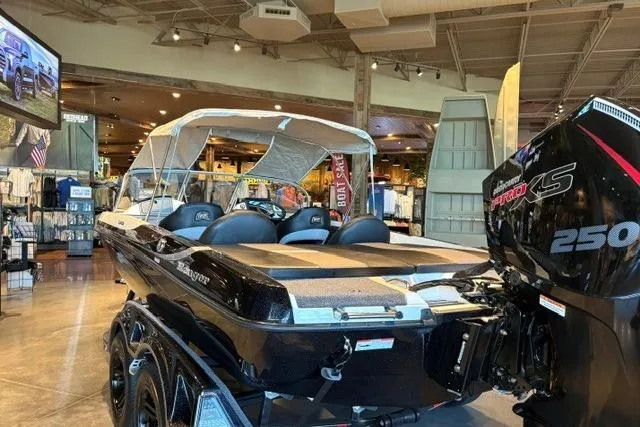 Slide: The Image of 2026 Ranger 212LS boat with Mercury 250 engine displayed in showroom. - 5