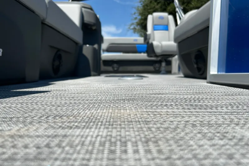 Slide: The Image of 2026 Sun Tracker Party Barge 22 RF XP3 interior with textured flooring and seating. - 27