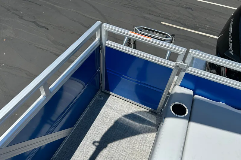 Slide: The Image of 2026 Sun Tracker Party Barge 22 RF XP3 pontoon boat interior with blue panels and seating. - 20