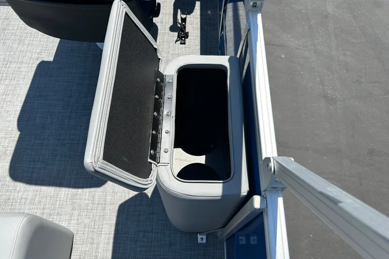 Slide: The Image of Open storage compartment on 2026 Sun Tracker Party Barge 22 RF XP3 pontoon boat. - 18