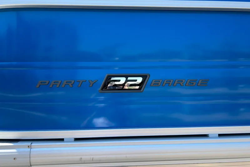Slide: The Image of 2026 Sun Tracker Party Barge 22 RF XP3 logo on blue background. - 28