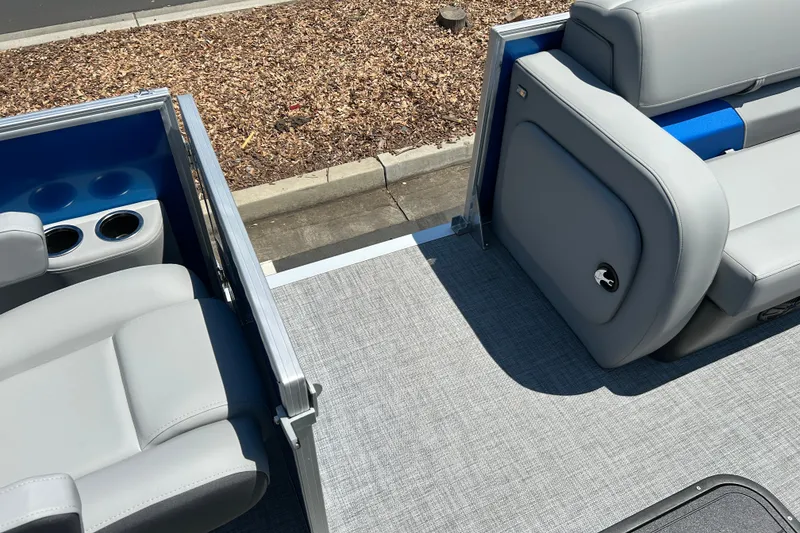 Slide: The Image of 2026 Sun Tracker Party Barge 22 RF XP3 interior with gray seating and cup holders. - 26