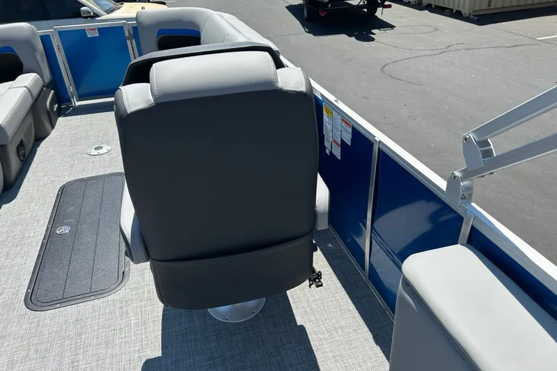 Slide: The Image of 2026 Sun Tracker Party Barge 22 RF XP3 interior with gray seating and blue paneling. - 23