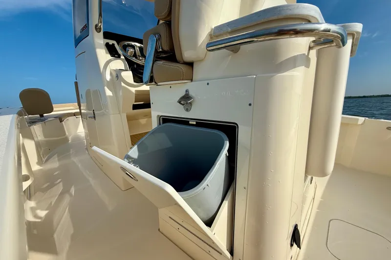Slide: The Image of 2026 Scout 261 XSS boat interior with open storage compartment, showcasing sleek design. - 32