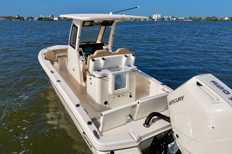 Slide: The Image of 2026 Scout 261 XSS boat on water, featuring Mercury outboard engine. - 20
