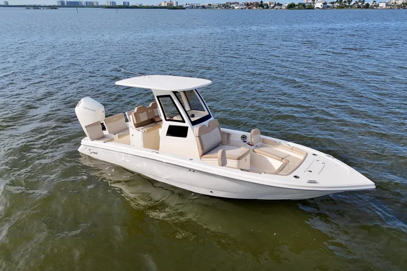 Slide: The Image of 2026 Scout 261 XSS boat on open water, featuring sleek design and modern amenities. - 18