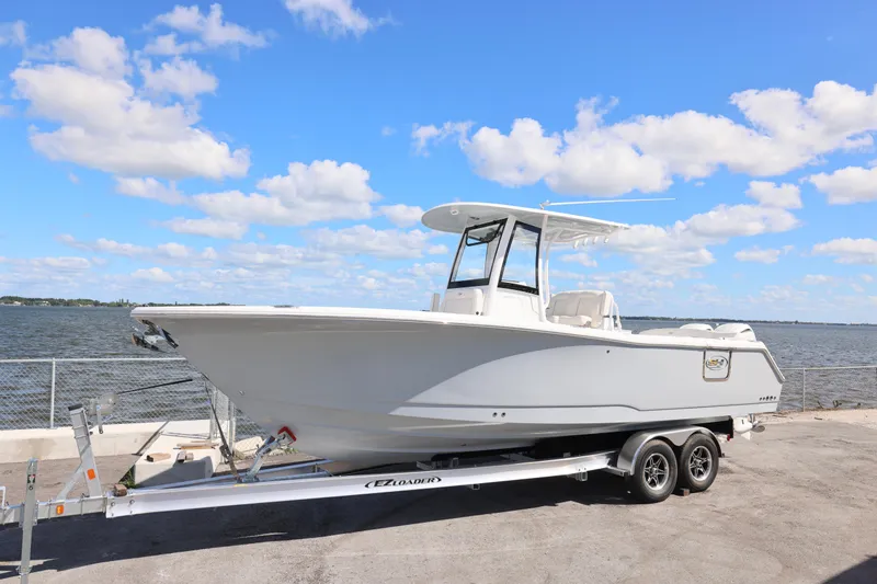Slide: The Image of 2026 Sea Hunt Ultra 275 Coffin Box boat on trailer by the waterfront. - 23