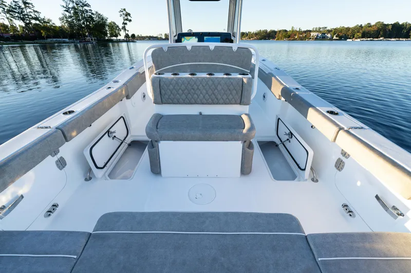 Slide: The Image of 2026 Sea Hunt Ultra 275 Coffin Box boat interior on calm water. - 39