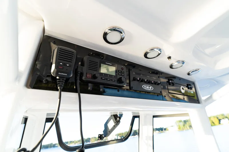 Slide: The Image of 2026 Sea Hunt Ultra 275 Coffin Box boat console with Garmin electronics and controls. - 36