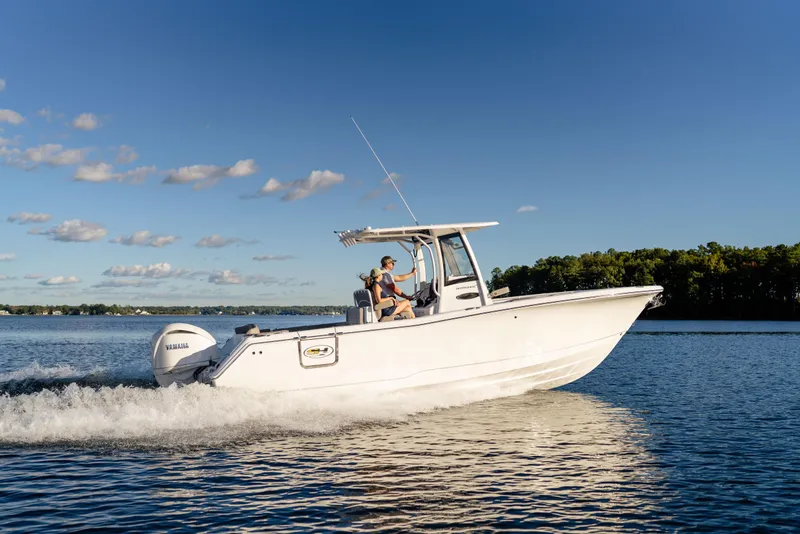 Slide: The Image of 2026 Sea Hunt Ultra 275 Coffin Box boat cruising on a sunny lake. - 60