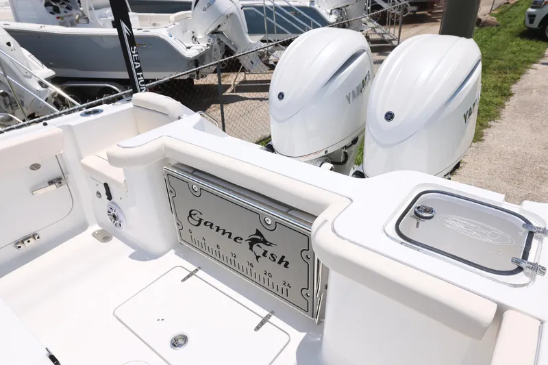 Slide: The Image of 2027 Sea Hunt Gamefish 25 boat with dual Yamaha engines and fishing features. - 5
