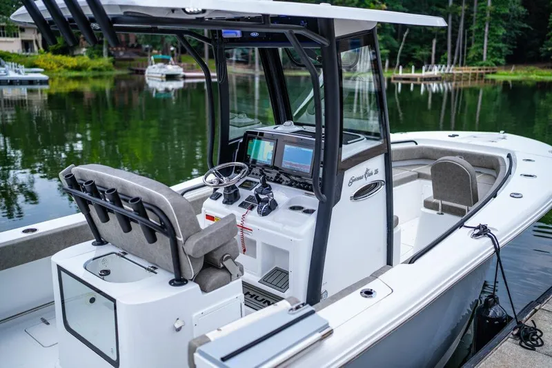 Slide: The Image of Manufacturer Provided Image: 2026 Sea Hunt Gamefish 25 boat with modern console, docked on a serene lake. - 35