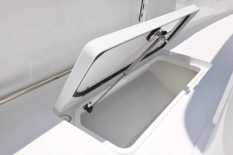 Slide: The Image of Open storage compartment on a 2027 Sea Hunt Gamefish 25 boat. - 12