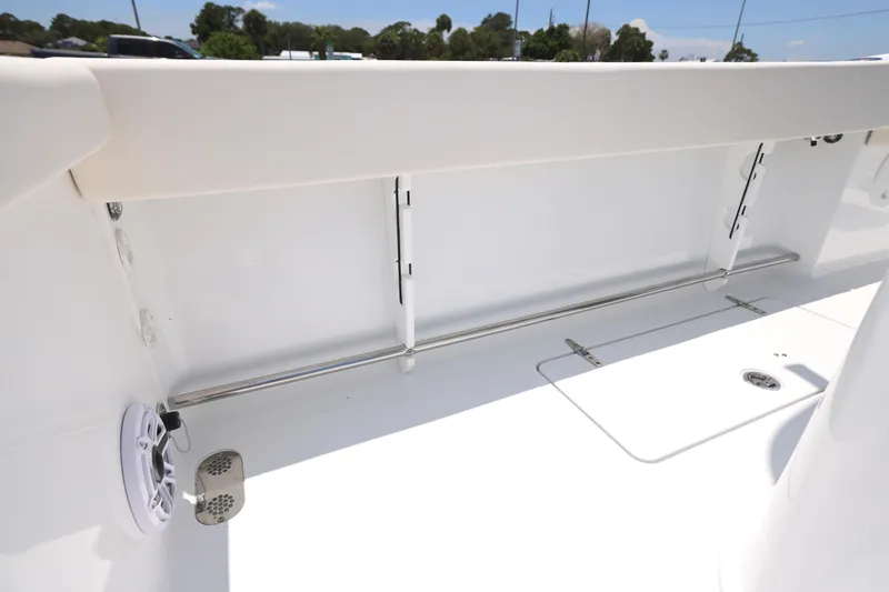 Slide: The Image of 2027 Sea Hunt Gamefish 25 boat interior with storage compartment and speaker. - 13