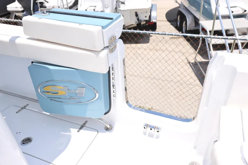 Slide: The Image of 2027 Sea Hunt Gamefish 25 boat interior with logo and seating detail. - 16