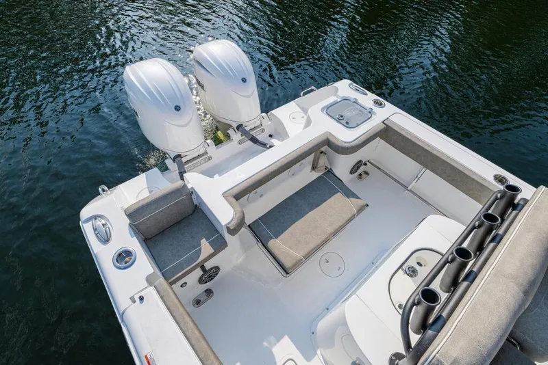Slide: The Image of Manufacturer Provided Image: 2026 Sea Hunt Gamefish 25 boat with dual engines, spacious deck, and rod holders on water. - 34
