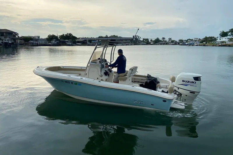 Slide: The Image of 2016 Pioneer 197 Sportfish boat with Suzuki engine on calm water. - 2