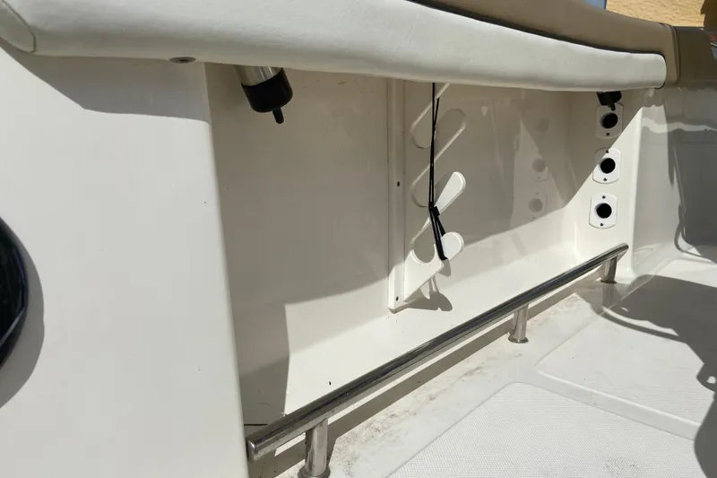 Slide: The Image of Interior view of a 2016 Pioneer 197 Sportfish boat, showcasing seating and rod holders. - 20