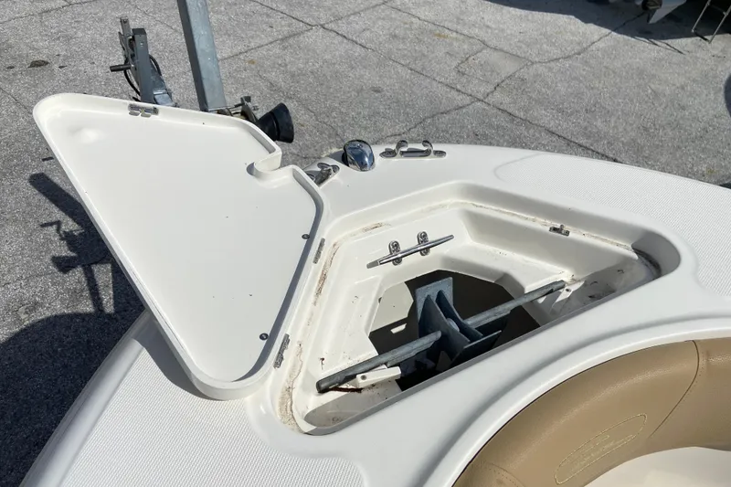 Slide: The Image of Open anchor compartment on 2016 Pioneer 197 Sportfish boat, showing anchor storage. - 28